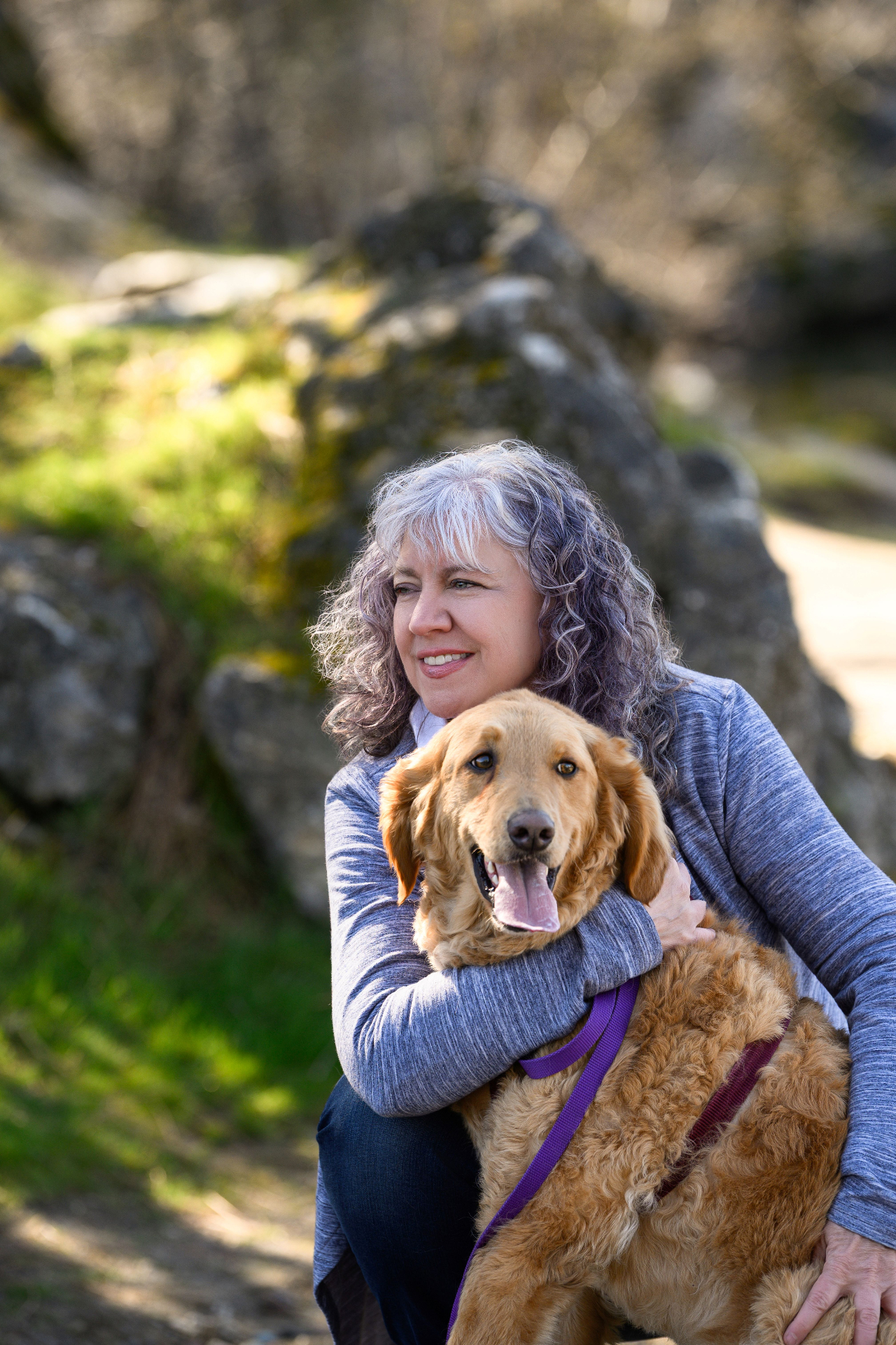 Mateer outdoors with her dog